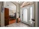 Inviting foyer with tiled floor, decorative transom window, and view into the formal dining room at 625 Waterland Ct, Orlando, FL 32828
