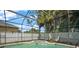 Relax in this backyard's screened-in hot tub, perfect for outdoor entertaining and relaxation in the sun at 625 Waterland Ct, Orlando, FL 32828
