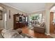 Well-lit living room with hard wood floors and large screen TV at 625 Waterland Ct, Orlando, FL 32828
