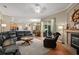 Spacious living room with a fireplace, a leather couch, and an open floor plan at 625 Waterland Ct, Orlando, FL 32828