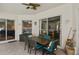 This outdoor patio offers a dining table, comfortable seating, and a serene space for gatherings and relaxation at 625 Waterland Ct, Orlando, FL 32828
