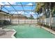 This backyard boasts a screened-in pool and hot tub, perfect for outdoor entertaining and relaxation in the sun at 625 Waterland Ct, Orlando, FL 32828