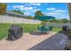 Paver patio in backyard with a grill and outdoor seating at 743 Lake Douglas Dr, Groveland, FL 34736