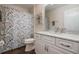 Bathroom featuring a shower and white vanity with marble countertop at 743 Lake Douglas Dr, Groveland, FL 34736