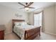 Cozy bedroom with a ceiling fan and a window providing natural light at 743 Lake Douglas Dr, Groveland, FL 34736