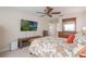 Bedroom featuring a television, dresser and a ceiling fan at 743 Lake Douglas Dr, Groveland, FL 34736