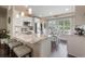 Stylish kitchen with granite countertops, stainless steel appliances, and a breakfast bar at 743 Lake Douglas Dr, Groveland, FL 34736
