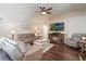 Relaxing living room with hardwood floors, a fireplace, and ample seating at 743 Lake Douglas Dr, Groveland, FL 34736