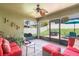 Covered outdoor patio with comfortable seating and views of the backyard at 743 Lake Douglas Dr, Groveland, FL 34736