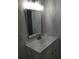 Bathroom vanity with white cabinets, white countertops and stainless steel faucet at 769 Avenue Q Se, Winter Haven, FL 33880