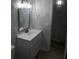 Bathroom with new vanity, a decorative light fixture, and fresh paint at 769 Avenue Q Se, Winter Haven, FL 33880