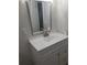 Bathroom vanity with white cabinets, white countertops and stainless steel faucet at 769 Avenue Q Se, Winter Haven, FL 33880