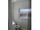 Clean bathroom with new vanity and neutral color scheme at 769 Avenue Q Se, Winter Haven, FL 33880