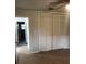 Bedroom featuring hardwood floors, closet with louvered doors, and neutral wall colors at 769 Avenue Q Se, Winter Haven, FL 33880