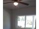 Bedroom features a ceiling fan and a window at 769 Avenue Q Se, Winter Haven, FL 33880