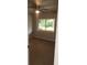 Bedroom featuring hardwood floors and a window overlooking a landscaped yard at 769 Avenue Q Se, Winter Haven, FL 33880
