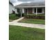 Quaint brick home with a well-maintained lawn and sidewalk at 769 Avenue Q Se, Winter Haven, FL 33880