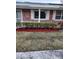Charming brick home featuring well-maintained landscaping and large windows at 769 Avenue Q Se, Winter Haven, FL 33880
