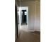 Hallway with hardwood floors, and white doors at 769 Avenue Q Se, Winter Haven, FL 33880
