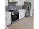 Modern kitchen with stainless steel appliances and stylish backsplash at 769 Avenue Q Se, Winter Haven, FL 33880