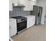 Bright, newly renovated kitchen with stainless steel appliances and tiled backsplash at 769 Avenue Q Se, Winter Haven, FL 33880