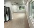 Open-concept living room with new flooring and plenty of natural light at 769 Avenue Q Se, Winter Haven, FL 33880