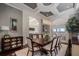 Dining room with decorative ceilings, chandelier, seating for eight and dark wood flooring at 8161 Via Rosa, Orlando, FL 32836
