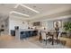 Modern kitchen with a large island, stainless steel appliances, and stylish lighting at 8161 Via Rosa, Orlando, FL 32836