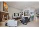 Comfortable living room featuring a modern fireplace and large windows at 8161 Via Rosa, Orlando, FL 32836