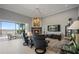 Cozy living room with a fireplace, views of the water, and comfortable seating at 8161 Via Rosa, Orlando, FL 32836