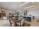 Open-concept living space with a kitchen island, dining area, and comfortable seating at 8161 Via Rosa, Orlando, FL 32836
