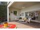 Screened-in patio with a chandelier and lots of comfortable seating for enjoying the outdoors at 8161 Via Rosa, Orlando, FL 32836
