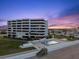 Beautiful beachfront condo building featuring a swimming pool and well-manicured lawn at 901 S Atlantic Ave # 3, Ormond Beach, FL 32176