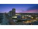 Stunning aerial view of oceanfront condo buildings along the coast at twilight featuring sandy beach and city lights at 901 S Atlantic Ave # 3, Ormond Beach, FL 32176