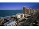 An aerial view of a beachfront condo community with ocean views, pristine sands and city access at 901 S Atlantic Ave # 3, Ormond Beach, FL 32176