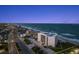 Aerial view showcases oceanfront condo with a swimming pool, close to beachfront avenue at 901 S Atlantic Ave # 3, Ormond Beach, FL 32176