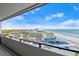 Balcony view of the ocean and condo complex under a partly cloudy sky at 901 S Atlantic Ave # 3, Ormond Beach, FL 32176