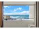 Balcony view overlooking the ocean with blue skies and a building to the side at 901 S Atlantic Ave # 3, Ormond Beach, FL 32176