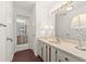 Bright bathroom featuring a marble countertop and decorative lamps at 901 S Atlantic Ave # 3, Ormond Beach, FL 32176