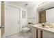Bathroom featuring a toilet, sink with marble countertops, and a shower at 901 S Atlantic Ave # 3, Ormond Beach, FL 32176