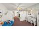 Spacious bedroom with white bunk beds and a comfortable sitting area at 901 S Atlantic Ave # 3, Ormond Beach, FL 32176