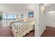 Bedroom features two beds with coastal-themed bedding, ocean view, and carpet flooring for a cozy retreat at 901 S Atlantic Ave # 3, Ormond Beach, FL 32176