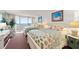 Bedroom with two beds, ocean view, and coastal decor, providing a relaxing and inviting space at 901 S Atlantic Ave # 3, Ormond Beach, FL 32176