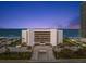 Oceanfront condo building with convenient access and ample parking, enhanced by palm trees at 901 S Atlantic Ave # 3, Ormond Beach, FL 32176