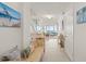 Hallway with a bench, ocean view, and light fixtures, enhancing the home's coastal ambiance at 901 S Atlantic Ave # 3, Ormond Beach, FL 32176