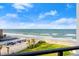 Beautiful ocean view from the condo, capturing the beach, blue skies, and well-maintained green space at 901 S Atlantic Ave # 3, Ormond Beach, FL 32176