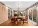 Inviting dining room featuring classic furniture, mirrored wall accents, and a seamless transition to the outdoor patio at 908 Hillary Ct # 15, Orlando, FL 32804
