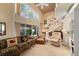 Cozy living room with high ceilings, large windows, and comfortable seating arrangement at 908 Hillary Ct # 15, Orlando, FL 32804