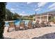 The community pool area offers comfortable lounge chairs and tables for relaxation at 908 Hillary Ct # 15, Orlando, FL 32804