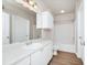 Bright bathroom shows a vanity and mirror, a shower-tub combo and white paint at 911 N Orange Ave # 541, Orlando, FL 32801